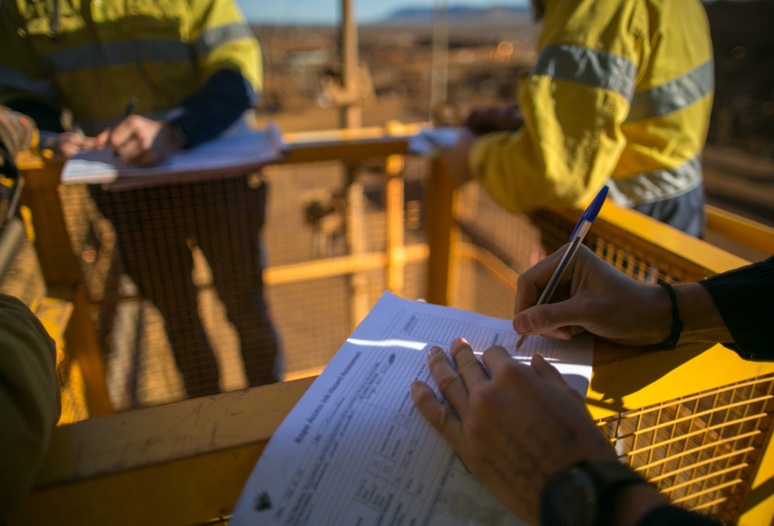 worker writing form onsite